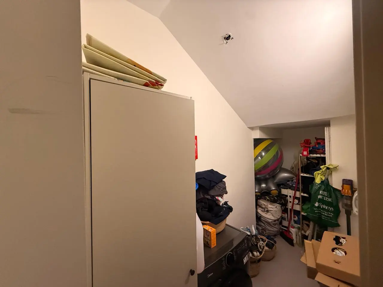 The lived-in townhouse, photo 10, shot on the agent's phone
